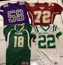 Four High School Football Jerseys , One Medium , Two Large And One X-Large