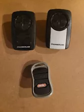 Set of three used Chamberlain programable garage door opener remotes *They work!