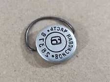 Russian military base seal stamp on keychain, war in Ukraine