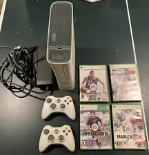 Xbox 360 console with controllers and games