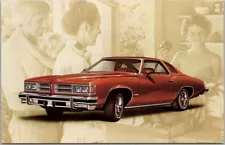 1976 PONTIAC LeMANS SPORT COUPE Advertising Postcard "Brown Pontiac" Amarillo TX