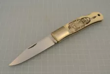 Custom Folding Knife by Jess Horn with scrimeshaw by Adam Funmaker