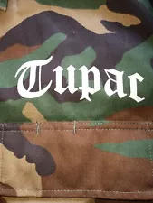 NEW TUPAC ALL EYES ON ME CAMOUFLAGE JACKET W TAGS..SIZE SMALL..23 PITS