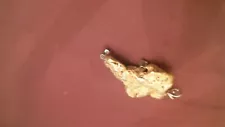 Alaska 23kt gold nugget pendent, 27.64 gr, 2 mounted diamonds 0.36 carats