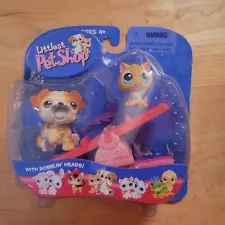 Littlest Pet Shop dog and kitty on seesaw