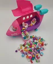 More than 80 assorted Shopkins in Shopkins Air Pink Jet Plane missing wings.