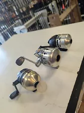 Lot of 3 Daiwa spincast fishing reels lot J14