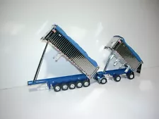 DCP FIRST GEAR 1/64 CHROME AND METALLIC BLUE EAST GENESIS ll END DUMP TRAILERS