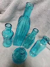 Turquoise bottles. Lot Of 5. Never Used. See Images For Sizes.