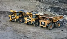 Photo 6x4 Brenkley Opencast Dump trucks in Brenkley opencast mine. c2011