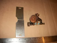 The Free Westinghouse sewing machine bobbin winder and access plates.