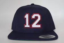 New England Patriots Tom Brady 12 GOAT Yupoong Snapback Hat.