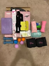 bundle of workout equipment: resistance bands, yoga block, ankle weights