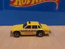 Hot Wheels Chevy Malibu Yellow 1982 Gold Wheels Hot Ones U.S.A. Taxi Service