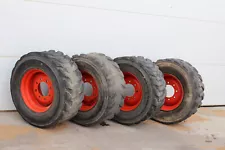 Used Bobcat skid steer tires on rims