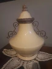 Vintage Beige/tan urn with wrought iron handles