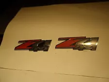 TWO CHEVROLET SILVERADO Z71 4x4 CHROME RED AND BLACK BODY EMBLEM USED