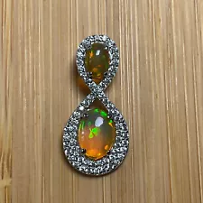 JTV OVAL CABOCHON ETHIOPIAN OPAL WITH ROUND WHITE ZIRCON SILVER PENDANT