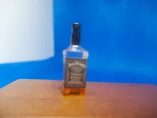 REDUCED NON OPENING HALF FULL BOTTLE OF JACK DANIELS FOR A DOLLS HOUSE