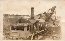 RPPC - MAN POSING ON STEAM, CABLE OPERATED STEAM SHOVEL CLEARING WAY FOR R.R.