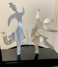 Two Rabbis in a joyous dance. Aluminum Judaical sculpture on plexiglass base