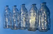 5 Old 8oz Clear Glass Baby Bottle Embossed ith Crawling Baby.