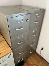 Two 4 drawer file cabinets, used