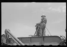 Loading hay from window with hayloader,central Ohio,OH,Farm Security Admin,1