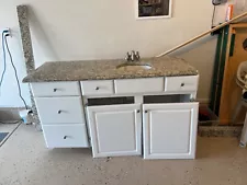 Bathroom vanity cabinet with countertop, sink and faucet