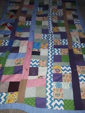 Homemade QUILT machine stitched colorful block pattern on top, brown bottom