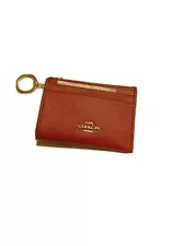 Up for sale is a brand new coach red mini skinny ID case key chain with tags