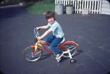 1975 Boy Riding Bike with Training Wheels in Driveway Vintage 35mm Slide