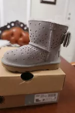 Ugg's classic mini bow Childrens water resistant bootie