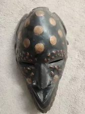 African mask With Nigerian Coins