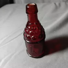 Wheaton Ruby Red Glass Bottle w/ Cannonballs & Drum Motif - 3-1/4" Tall