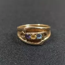 14k Gold Ring. Size 6.5. Acid tested for purity. Unknown gems.