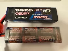 Two drained Traxxas batteries, LiPo 7600mAh 7.4V 2-cell and NiMH 3000mAh 8.4V