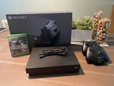 Microsoft Xbox One X 1TB Console. Two Controllers, Charging Station, And CoD MW