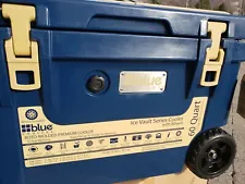 SALE! BLUE COOLER 60 QUART ICE VAULT ROTO-MOLDED W/WHEELS. NEW IN BOX