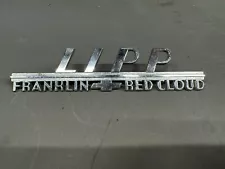 Vintage Car Dealer Emblem Nameplate Lipp Chevy Franklin Red Cloud Nebraska Logo