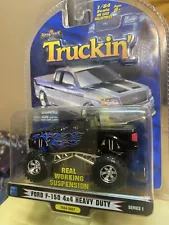 1 Badd Ride Truckin 1:64 Ford F-150 4x4 Lifted Monster Truck Black W Blue Flames