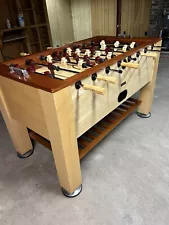 classic sport foosball table. 2 tones of wood, adjustable metal feet.