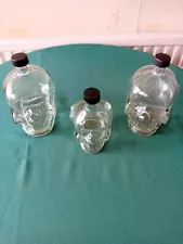 3 Glass Skull Shaped Bottles