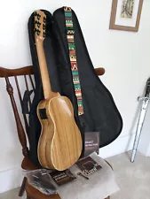 caramel guitalele, left handed, zebra wood, adjustable truss rod, gently used