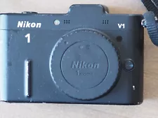 Nikon 1 V1 10.1MP Digital Camera - Black body only w/ flash, book as-is working!