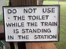 CAST IRON DO NOT USE THE TOILET WHILE TRAIN IS IN STATION RAILROAD SIGN PLAQUE!