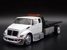 INTERNATIONAL DURASTAR FLATBED TOW TRUCK WRECKER 1/64 SCALE DIECAST MODEL CAR