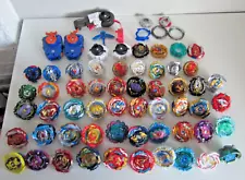 Huge lot of 49 Beyblades - Assorted types and styles + spare parts + Launchers