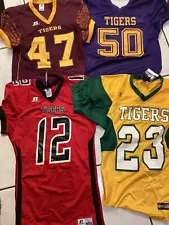 Four High School Football Jerseys , One Medium , Two Large And One No Tag