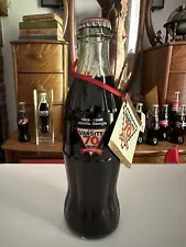 This Sale Is For (1) 1998 70th Anniversary Varsity 8oz Coca Cola Bottle.